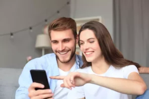 Young couple using smart phone